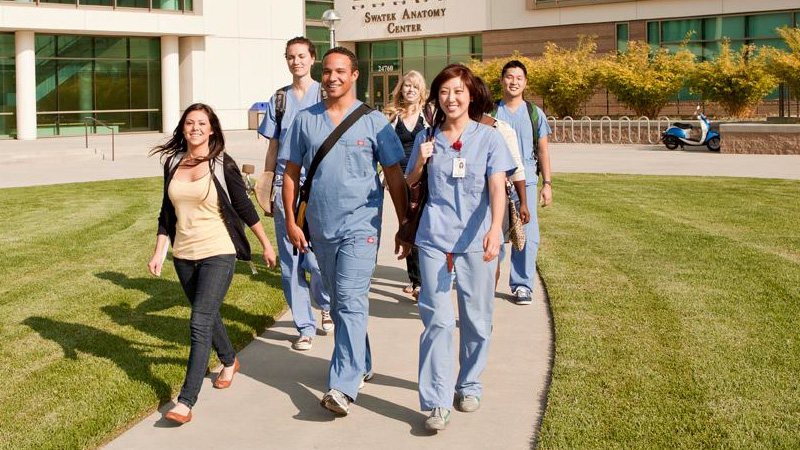 Residency students walking on pathway