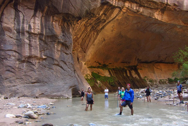 students on field trip in river